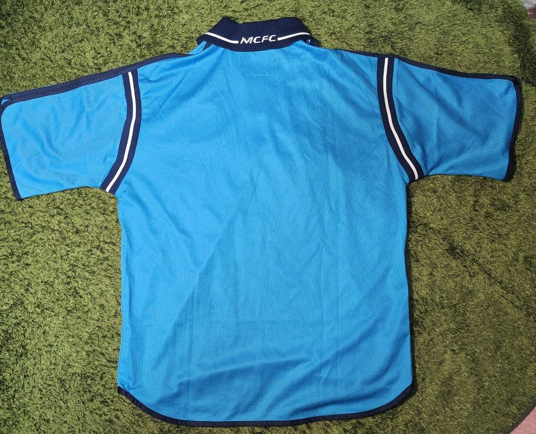 マンチェスターシティ　le coq sportif
