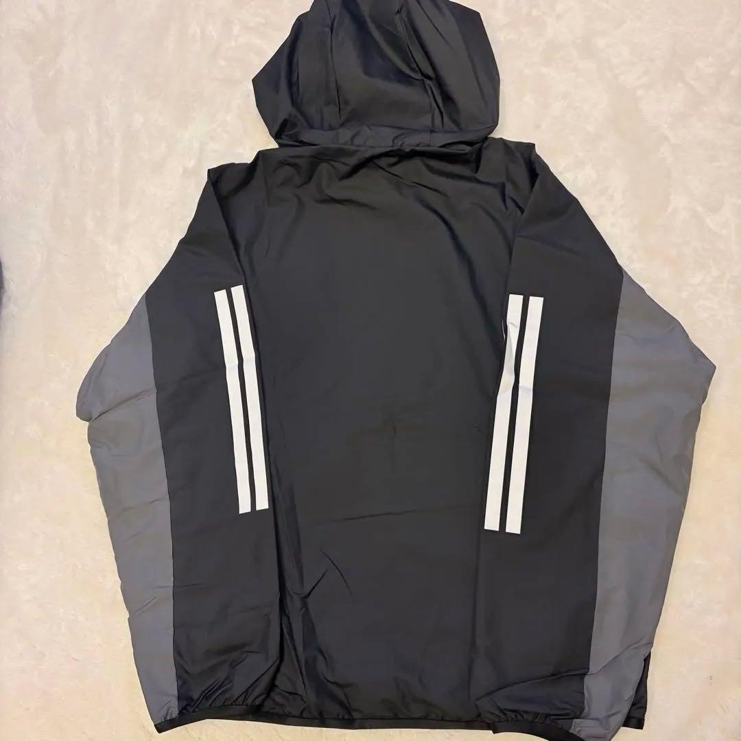 adidas レディースフード付きウィンドブレーカー 黒・グレー