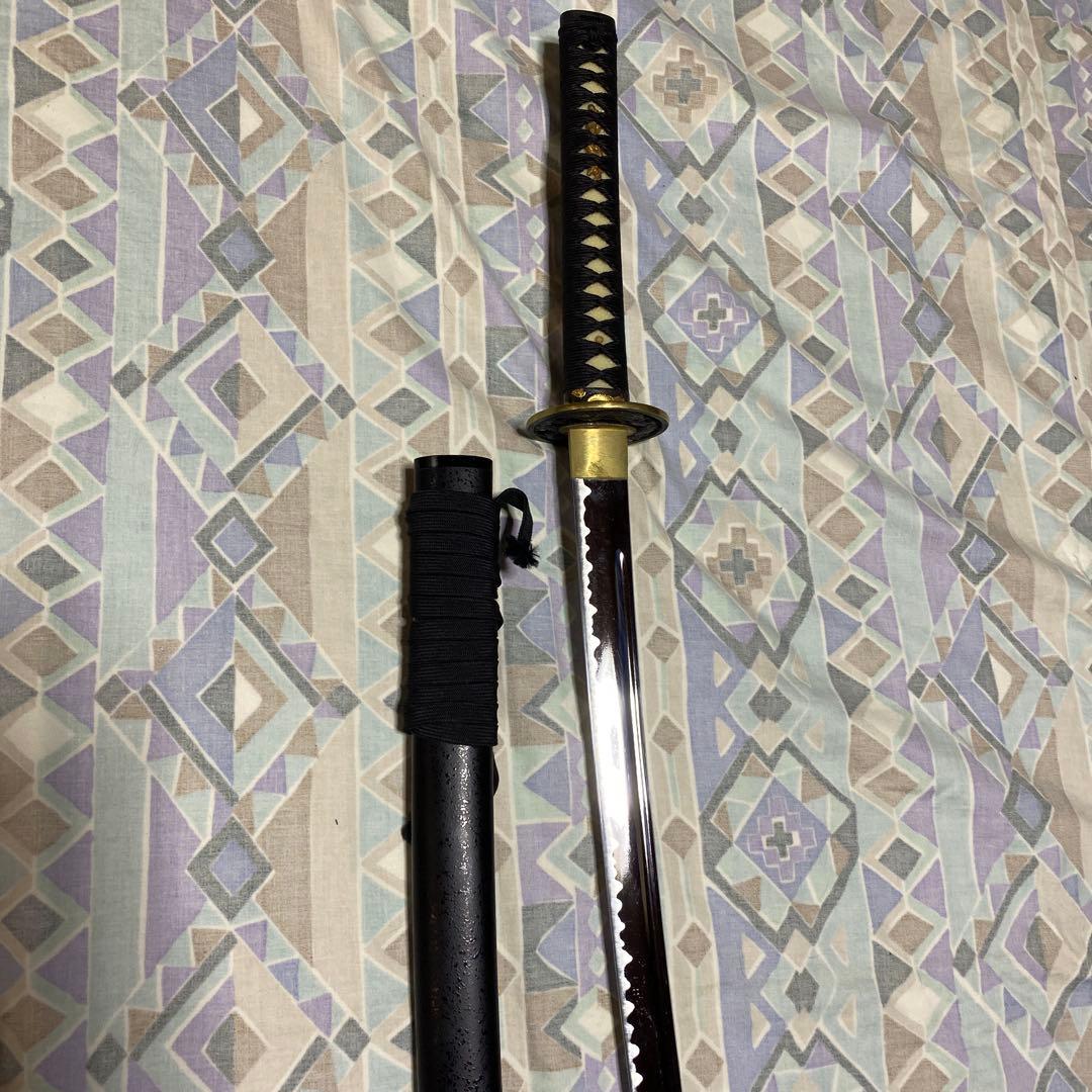 上級居合刀 黒柄 龍彫透し金縁丸鍔 黒梨地鞘