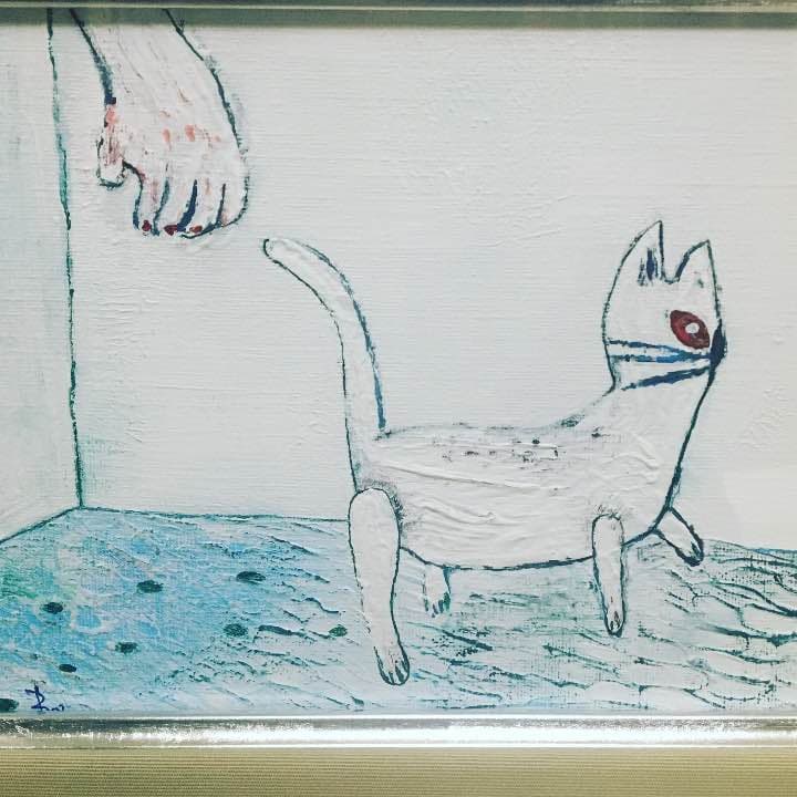 逃げるネコ
