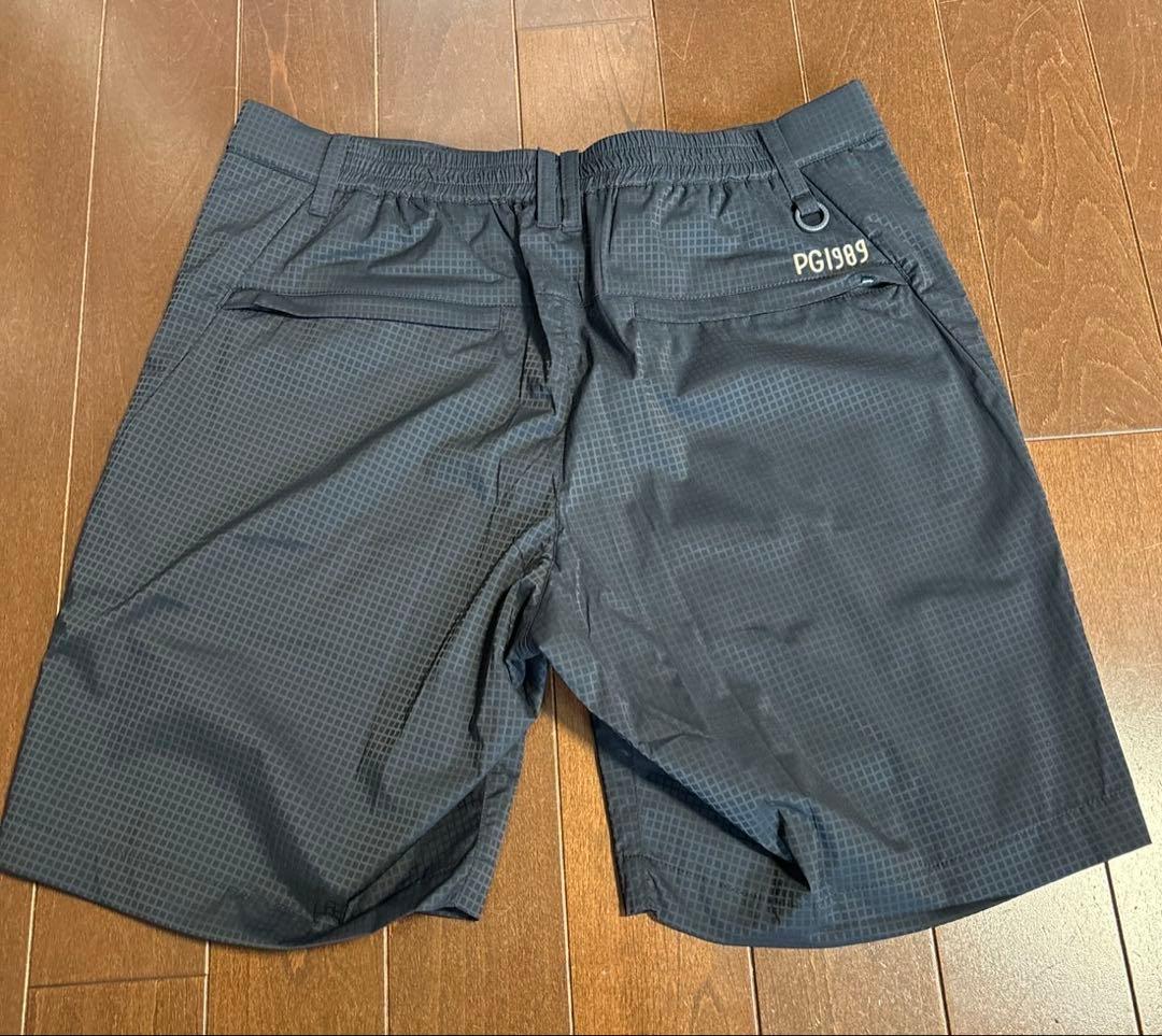 パーリーゲイツ P e ＷJQヘリポン　ハーフパンツ濃紺×黄色サイズ6